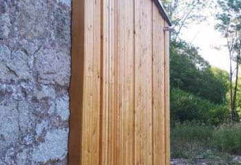 Extension en bois d’une maison en pierre bardage 1